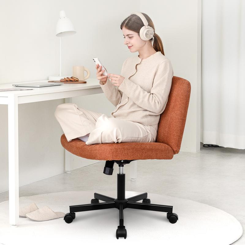 Cross-legged chair, with its wide seat filled with high-density sponge, orange